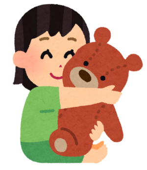 ぬいぐるみを抱く