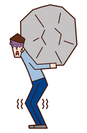 重荷を背負う男性